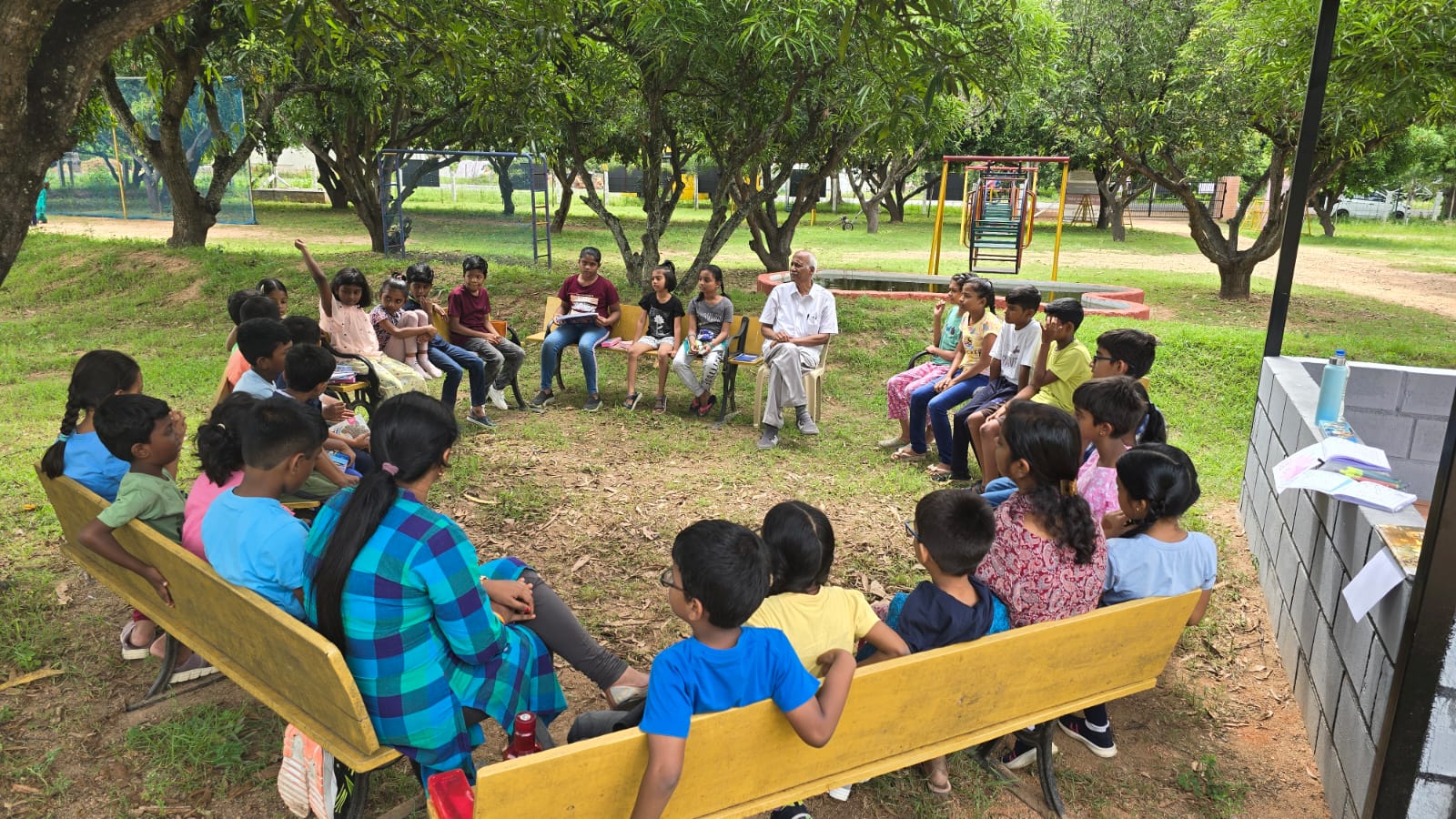 Mango Woods students and mentors learning together beneath the trees