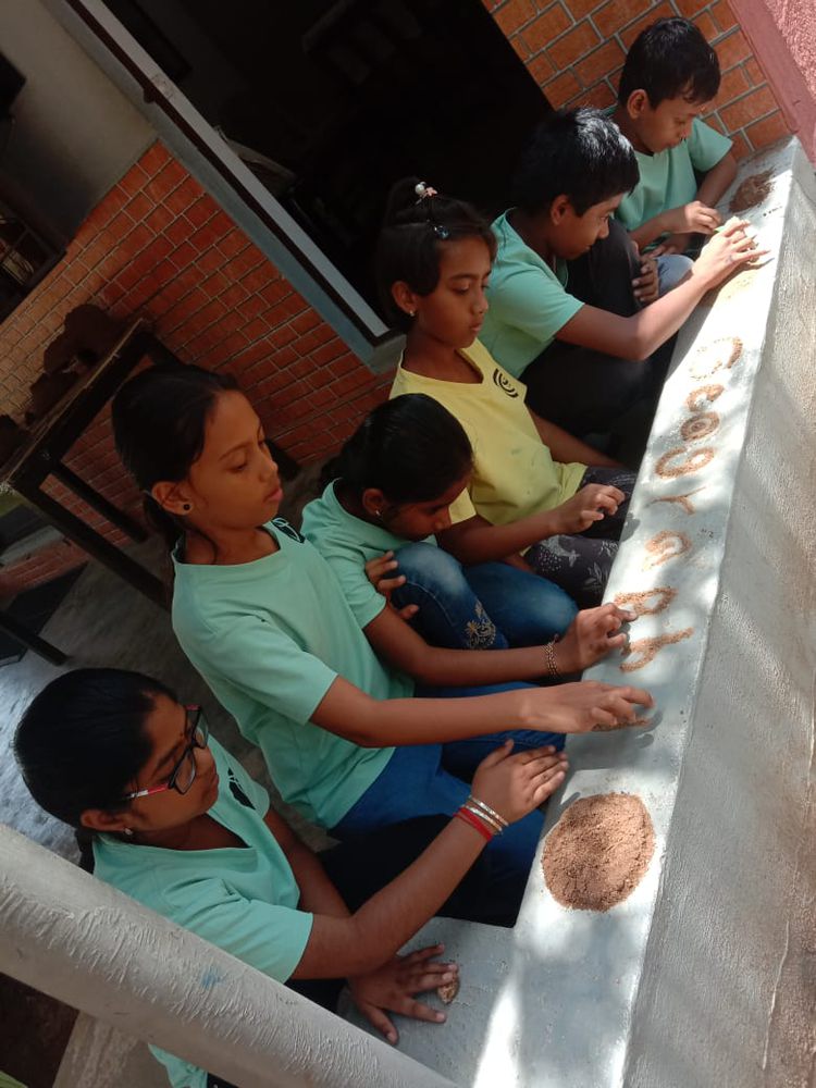 Children of all ages learning together at Mango Woods School