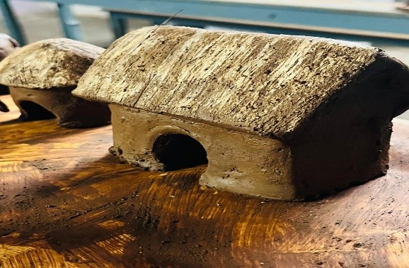 A clay house modelled by the children