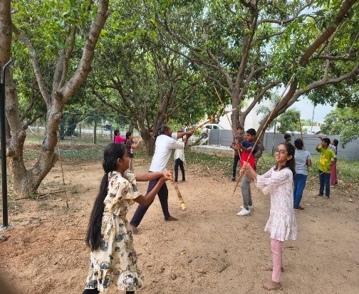 Children playing together among the trees